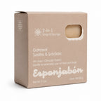 A 60 g box of Esponjabón Oatmeal Soothe & Exfoliate 2-in-1 Soap & Sponge, shown on a clean white background. The packaging is a natural kraft brown cardboard box with white text and a die-cut window showing the beige soap sponge inside.
